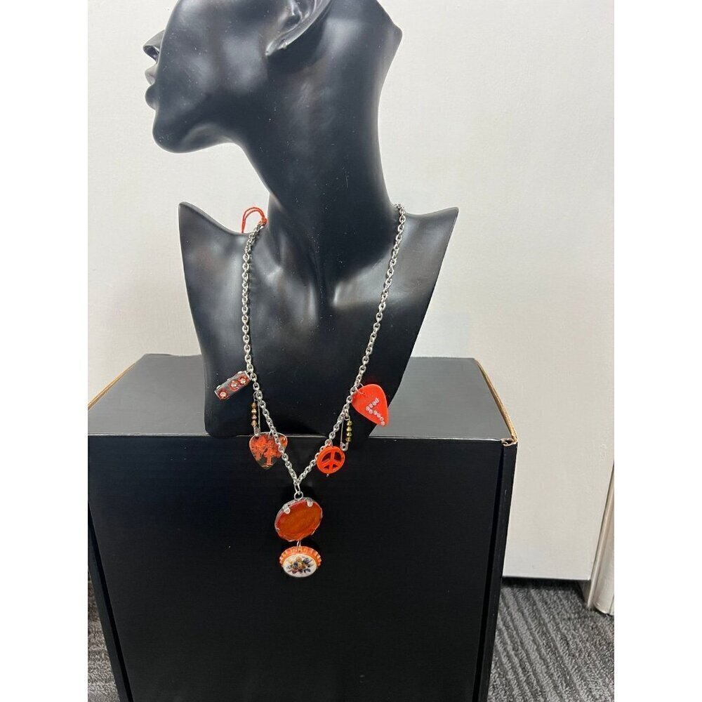 Orange crystal pendant with bottle caps, guitar picks safety pin beads necklace